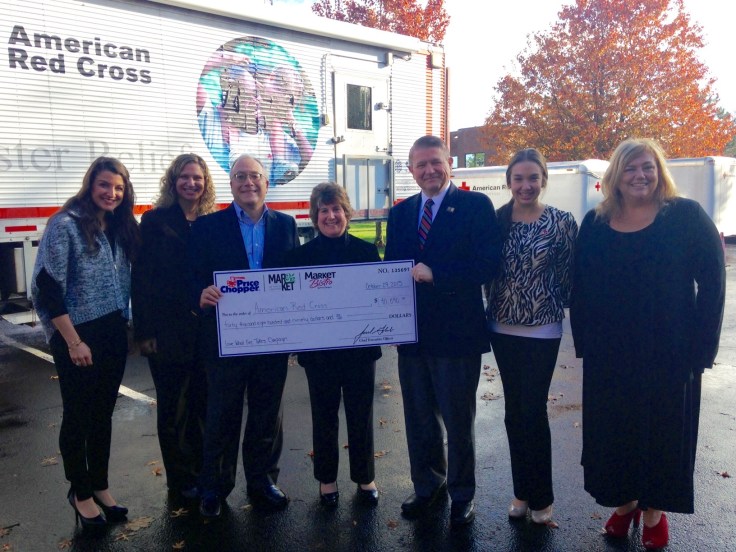 Representatives from Price Chopper/Market 32 and NewsChannel 13 present a check totaling $40,890 to the American Red Cross to support Home Fire Relief.